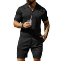 Men's black short sleeve shorts suit with wave pattern texture on cotton blend fabric.