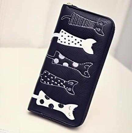 Black women's fashion wallet open showing six card slots and zipped note compartment, 10 cm wide genuine leather