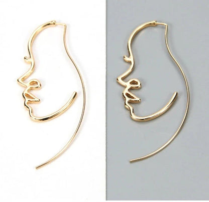 Abstract face contour earrings in gold and silver, 75mm x 35mm