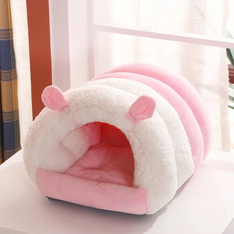 Closed round cat nest bed in blue, pink, or purple with soft plush interior and anti-skid bottom.