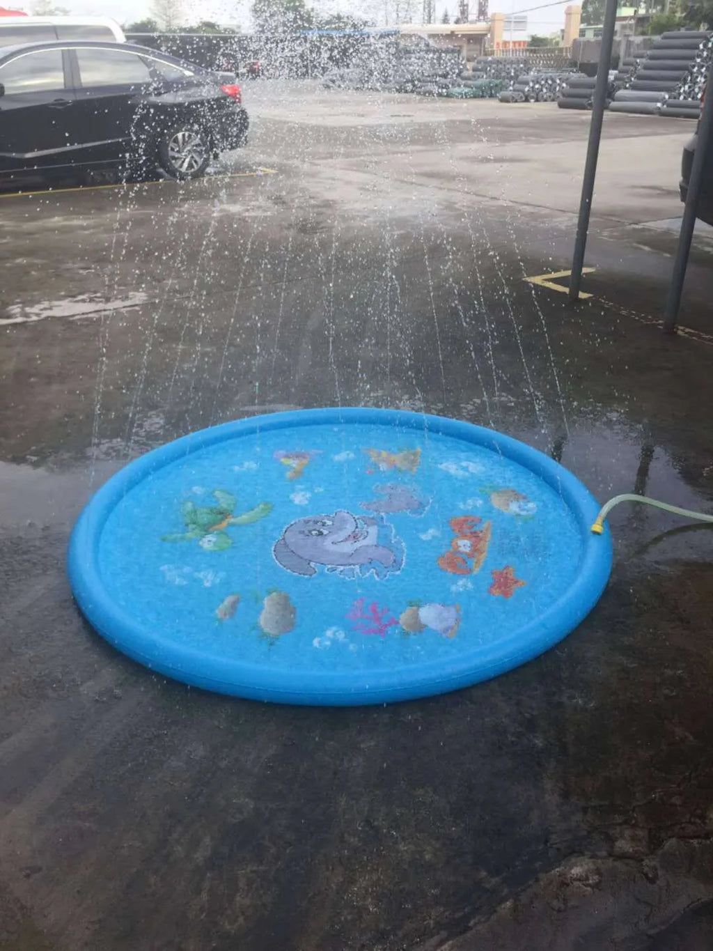 Blue PVC children's water spray play mat with marine animal graphics measuring 100cm by 170cm