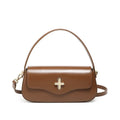 Genuine leather baguette handbag in black with clamshell opening showing internal phone and document pockets
