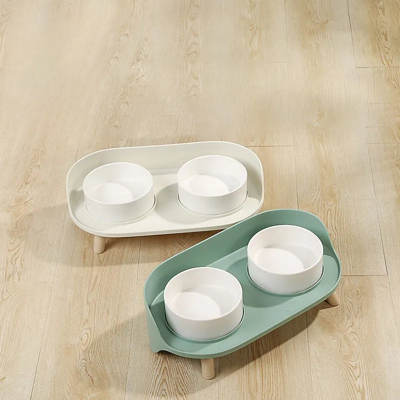 Green adjustable pet bowl set with tilted double compartments for food and water feeding