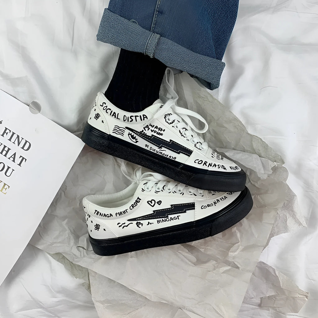 Women's white canvas shoes low top with lace-up tie and graffiti pattern on non-slip vulcanised sole