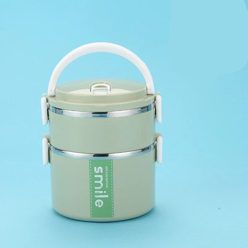 Stainless steel lunch box with built-in spoon, leak-proof design, in green, pink, and blue