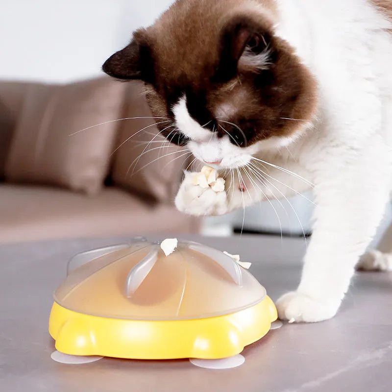 Yellow plastic interactive cat puzzle feeder toy with compartments for treats