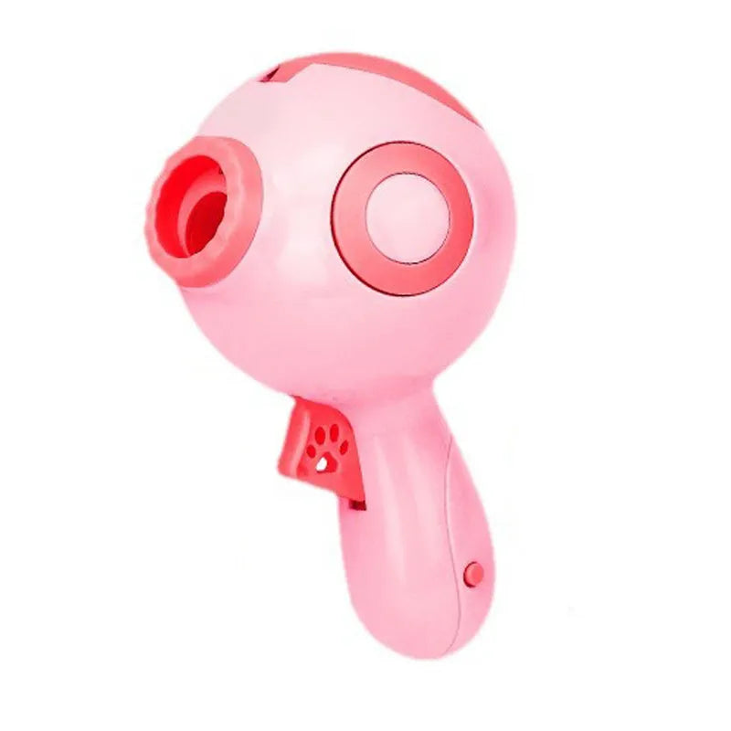Green, orange, and pink dog treat launcher toy for interactive feeding and training.