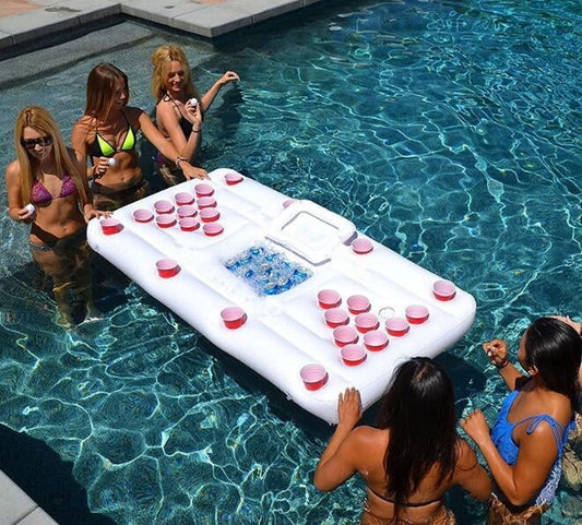 White inflatable beer pong table with built-in cooler floating in pool