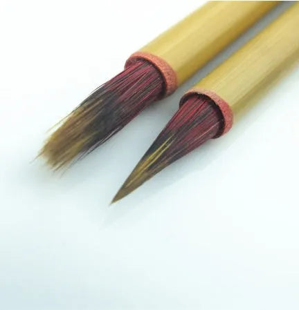 Red Chinese calligraphy writing brush with mixed hair brush head on wooden penholder
