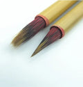 Red Chinese calligraphy writing brush with mixed hair brush head on wooden penholder