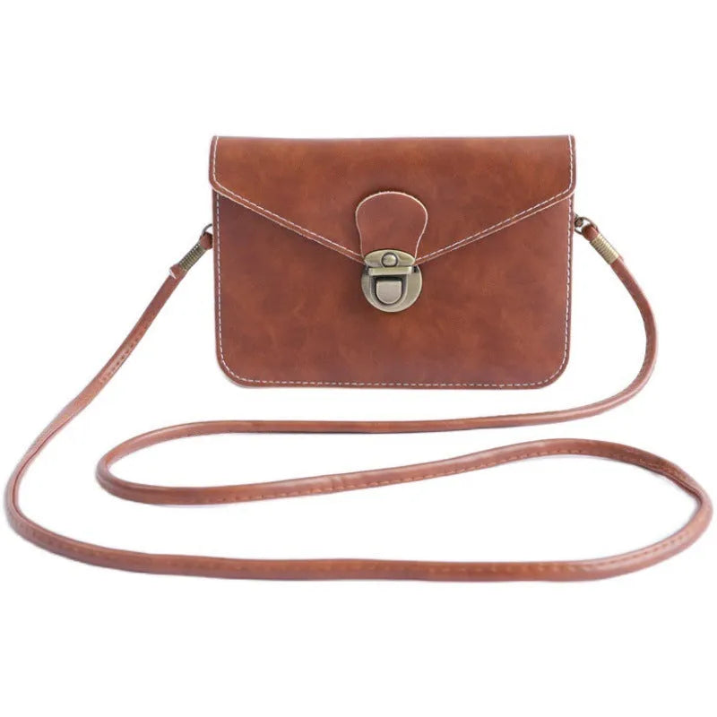 Retro soft surface messenger bag with crossbody strap and secure lock closure