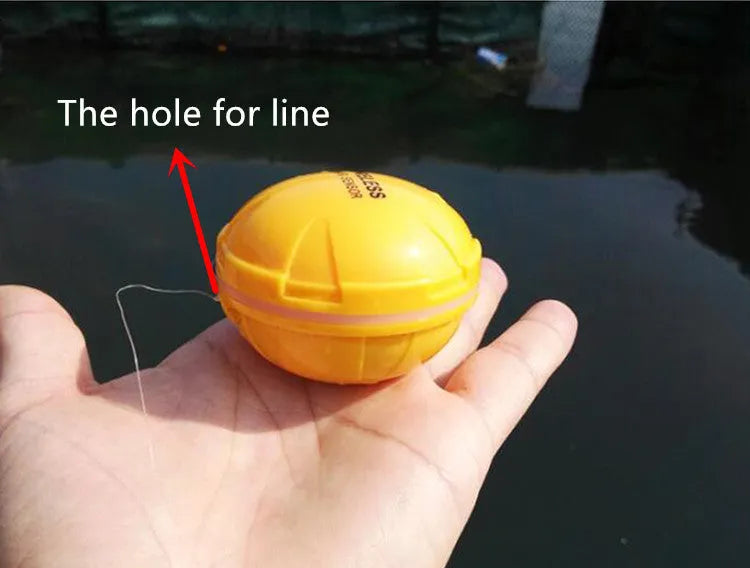 Yellow wireless sonar fish finder on water with depth reading display