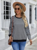 Black long sleeve pullover sweater with a printed plaid stripe pattern on a mannequin.
