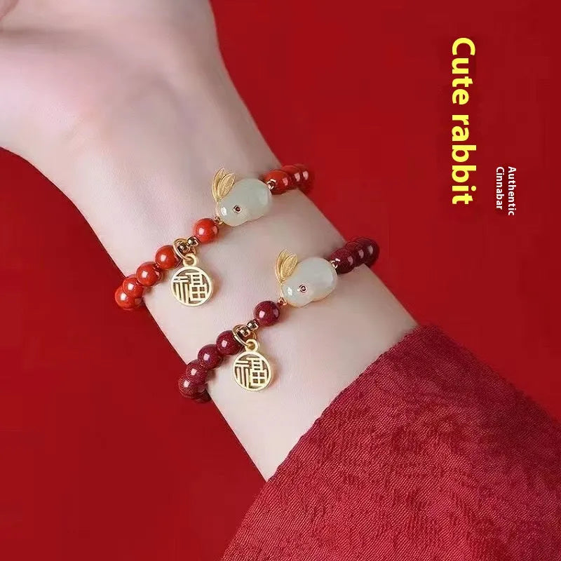 Purple gold sand cinnabar bracelet with jade hare charm in retro style.