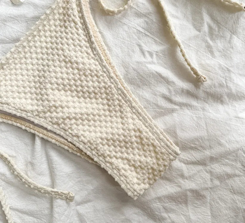 Women's halter lace-up bikini swimsuit in milky white with adjustable side ties
