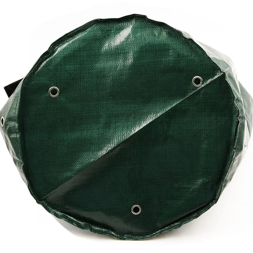 Dark green PE cloth garden planting bag with side windows and double handles on a balcony