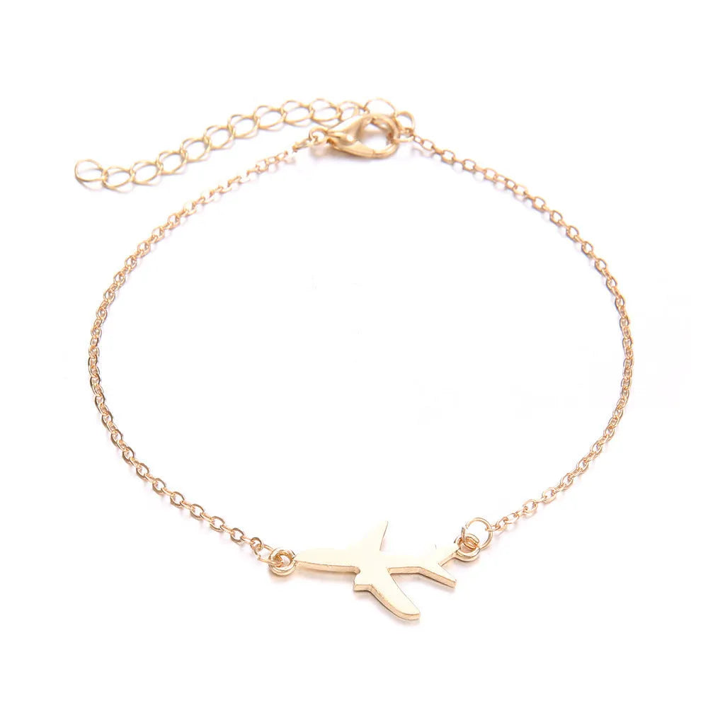 Set of three bohemian-style women's bracelets with heart-shaped aircraft map charms in alloy.