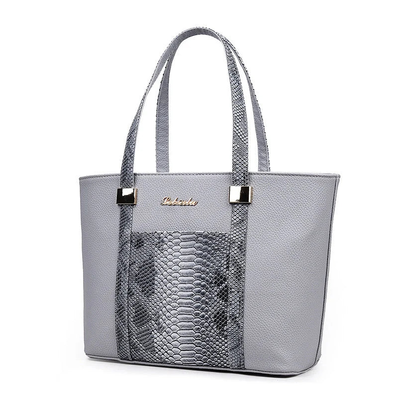 Elegant women's shoulder bag with zipper and organised pocket in light grey, black, off-white, and rose red