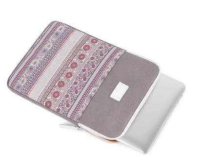 Canvas laptop sleeve showing size options for 11-15 inch devices with protective padding
