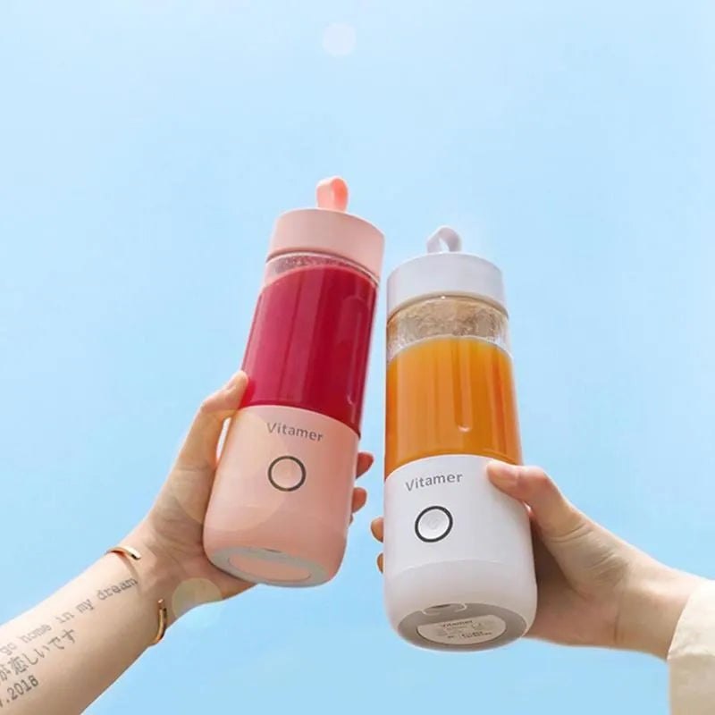 White portable USB rechargeable blender bottle with silicone handle and stainless steel blade.