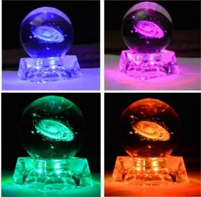 Mesmerizing Galaxy Crystal Ball made with premium K9 crystal, showcasing swirling celestial patterns and available in various sizes and base options.