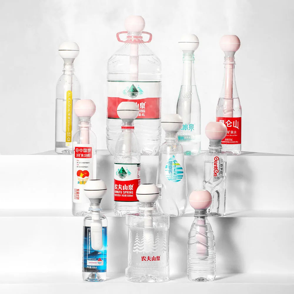 Magic Wand columnar USB-powered ultrasonic humidifier in pink or white for small rooms.