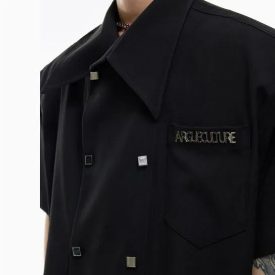 Men's loose-fit short-sleeved casual shirt with lapel collar and decorative button detail.