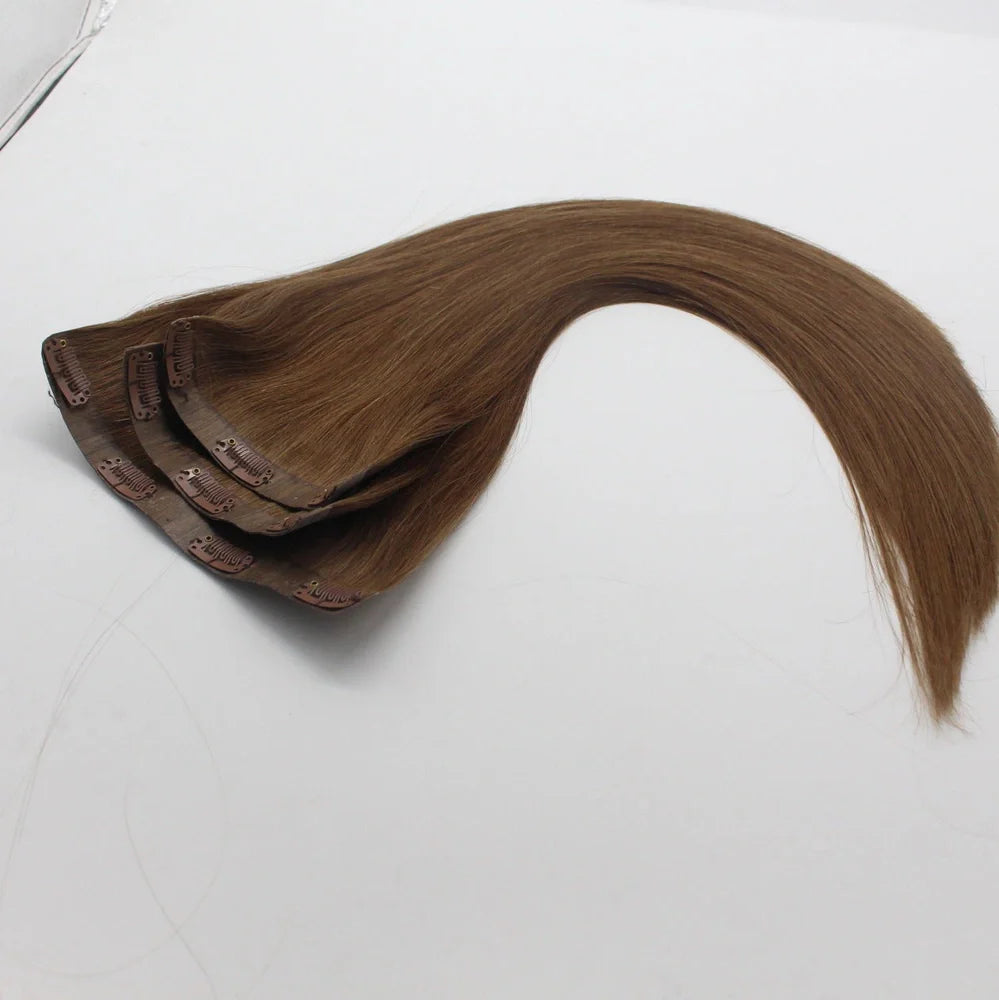 Clip-in human hair extensions in various lengths from 10 to 30 inches with secure attachment clips