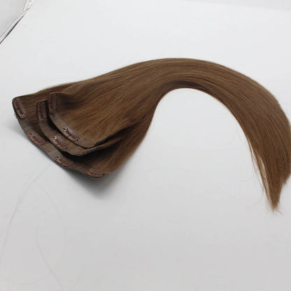 Clip-in human hair extensions in various lengths from 10 to 30 inches with secure attachment clips