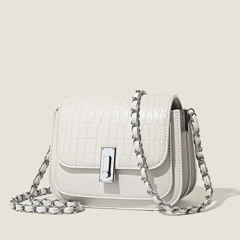 Soft black PU women's chain shoulder bag with sewing thread detail and a phone pocket.