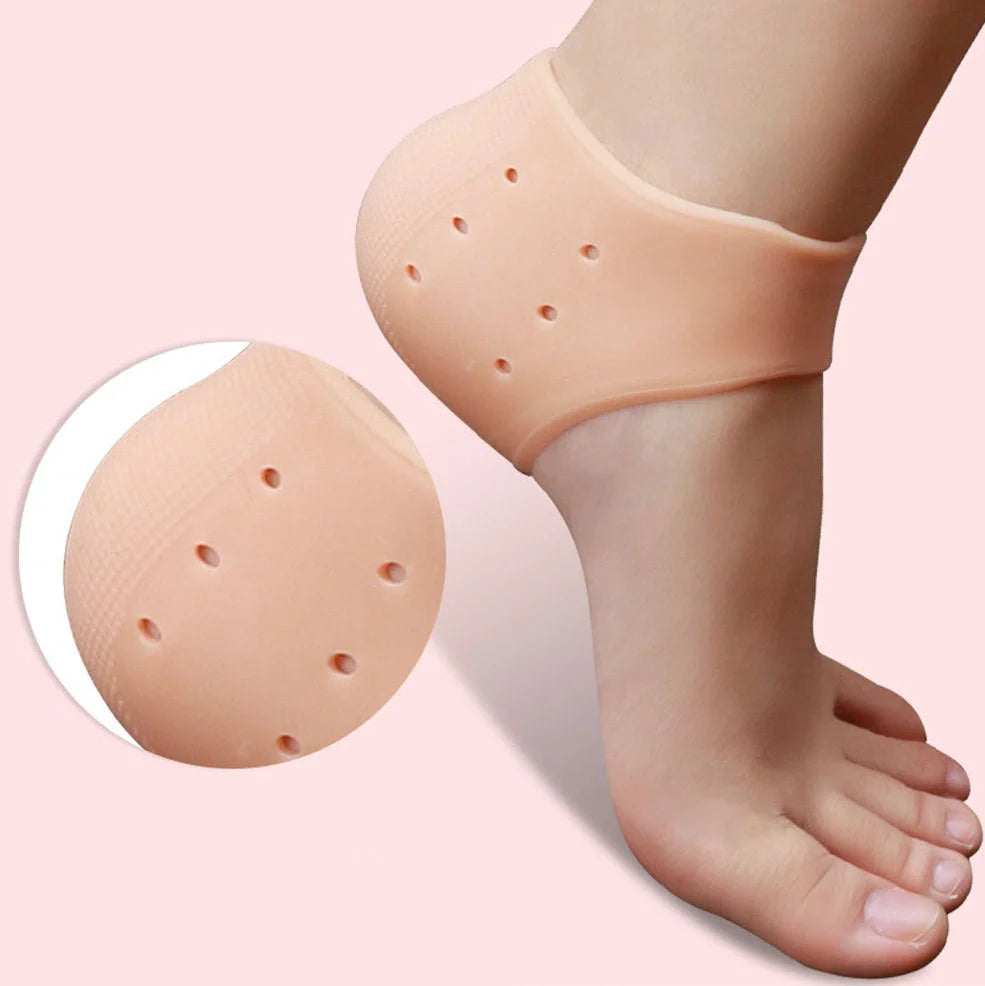 Perforated silicone heel protector in white, showing medical-grade material and breathable design