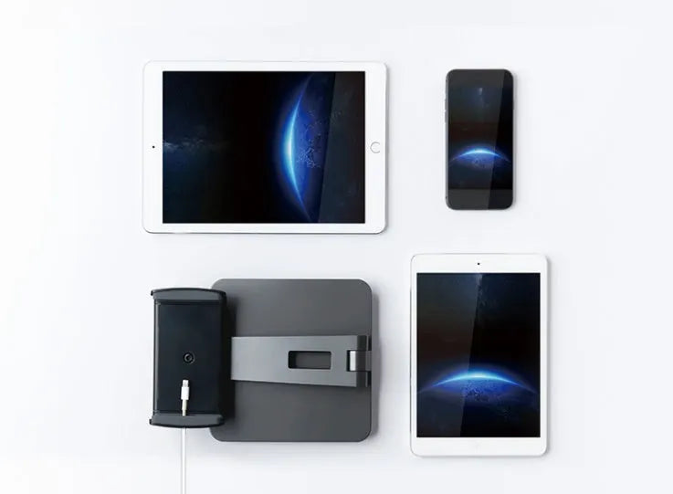 Silver aluminium foldable desktop stand holding a tablet, showing 360-degree rotation.