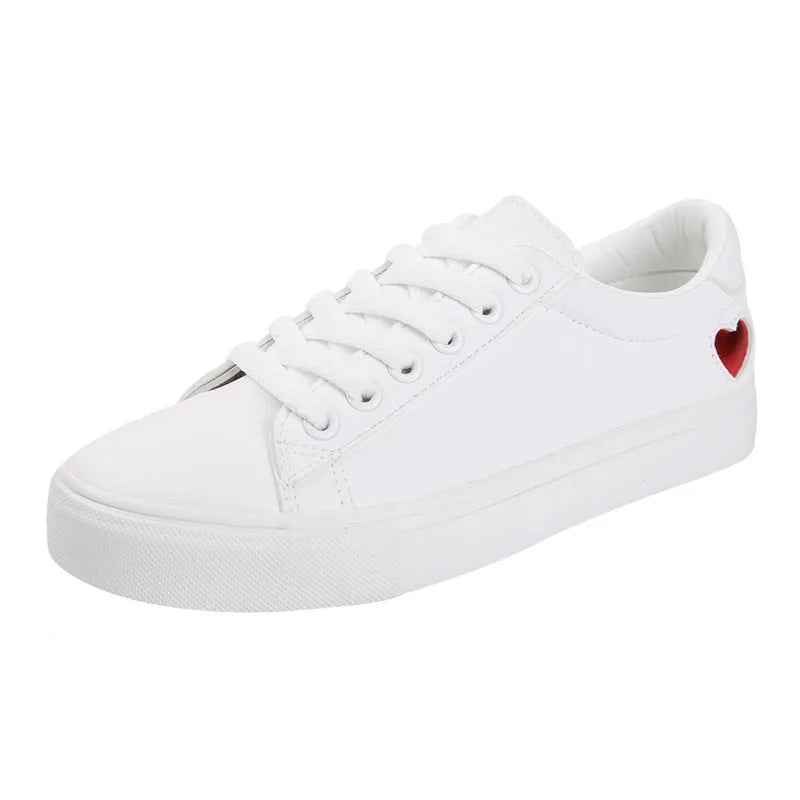 Women's PU leather heart pattern flat shoes in white red colour with non-slip rubber sole