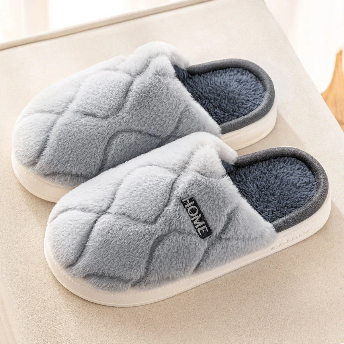 Cozy plush slippers with soft, plush upper material and durable PVC sole for comfortable and secure indoor wear