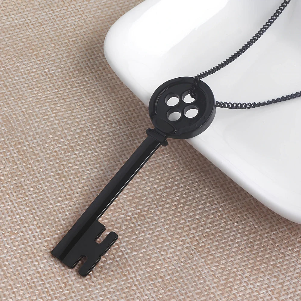 Unisex black key pendant necklace with star details on alloy chain, electroplated for durability, 45-50cm length