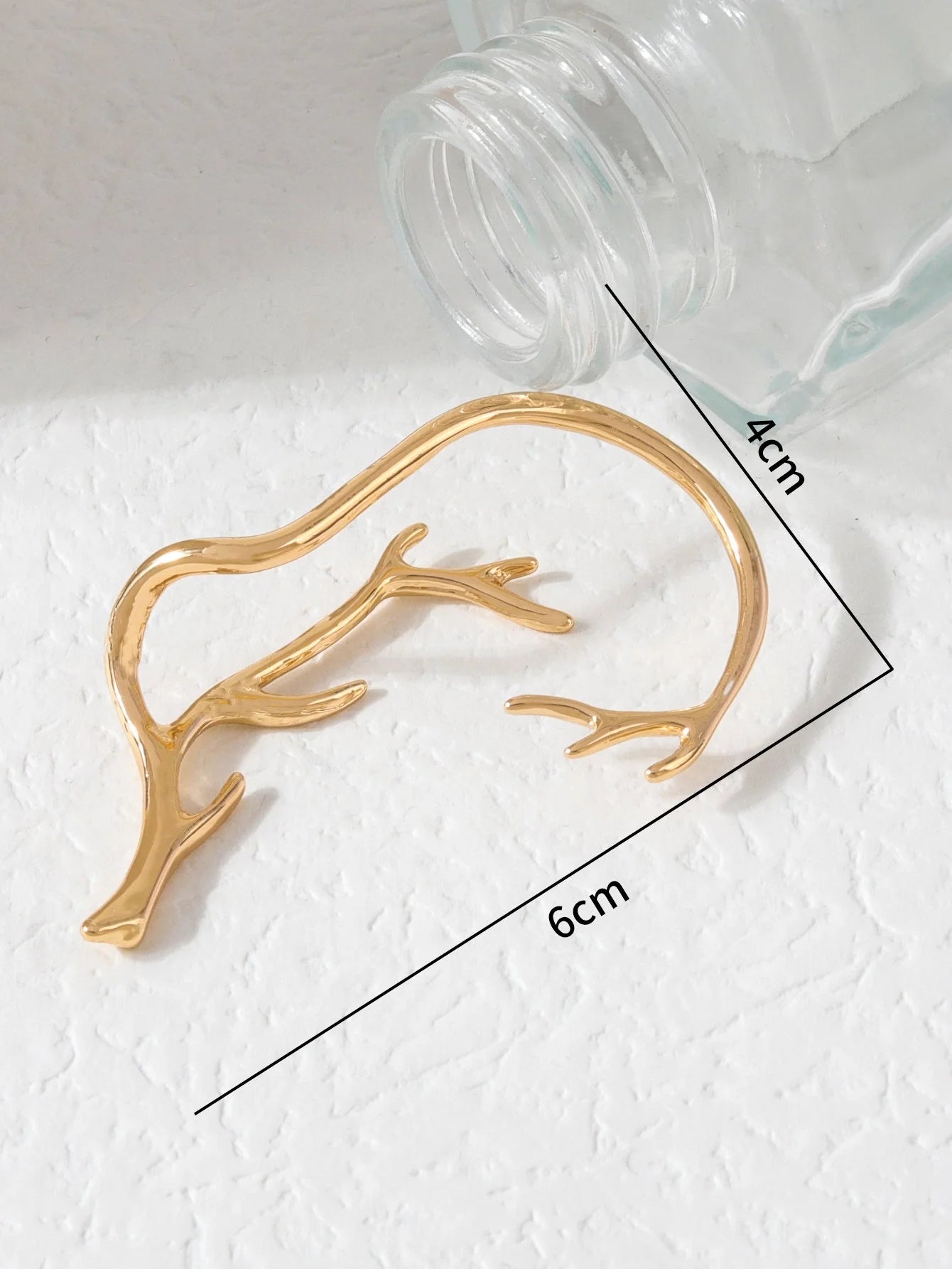 Vintage bone hypoallergenic elf earrings in gold, silver, black, and green with geometric design