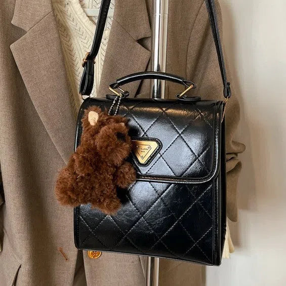 Mini PU backpack in brown with stitching design and a pendant option