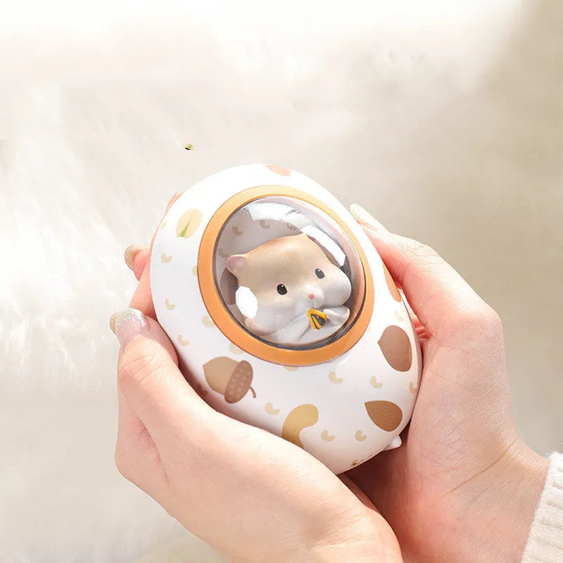 White Hamster brand hand warmer and power bank with 5000mAh capacity on a plain background.
