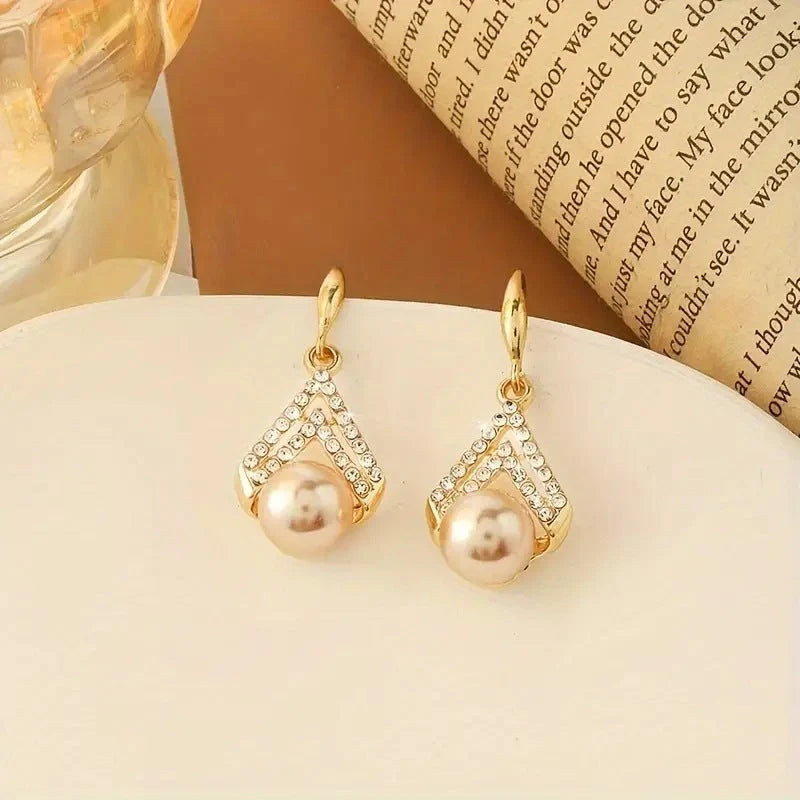 Water Drop Pearl Earrings in gold, white, and champagne with geometric design