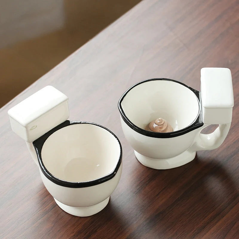 Humorous toilet-shaped ceramic coffee mug with handgrip, perfect for gag gifts or unique decor