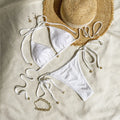 Women's halter lace-up bikini swimsuit in milky white with adjustable side ties