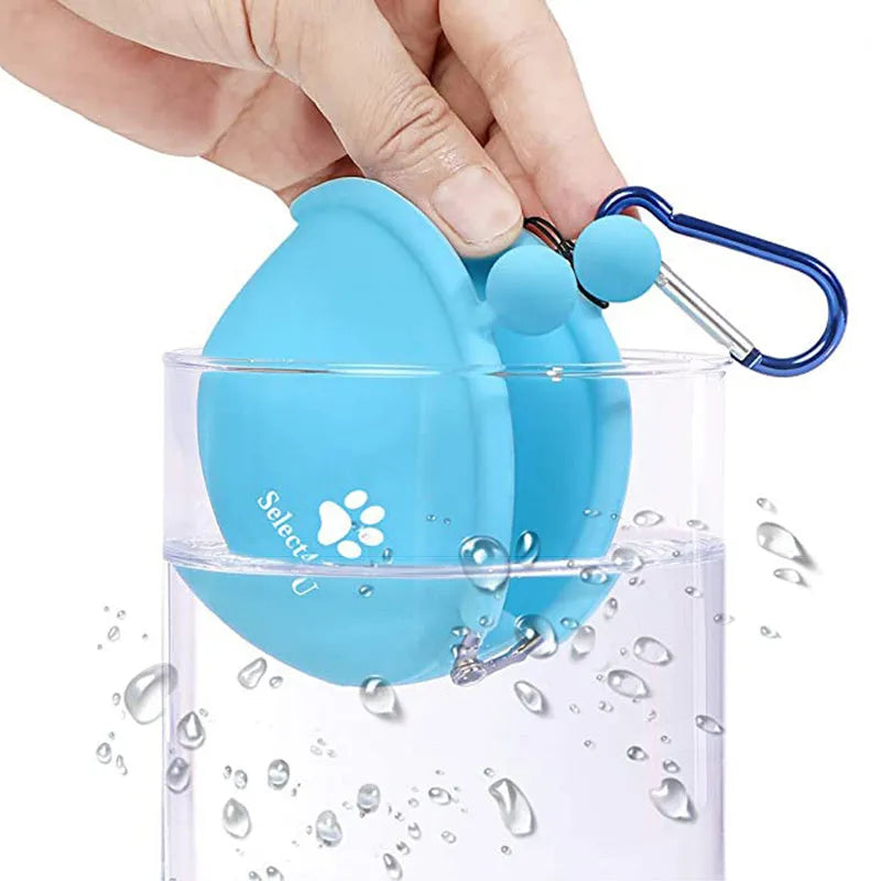 Yellow silicone dog treat bag with waist clip, shown open to reveal storage pocket.