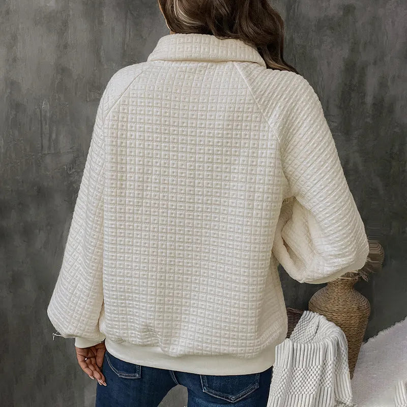 Women's textured polo collar solid colour sweater in beige on a hanger.
