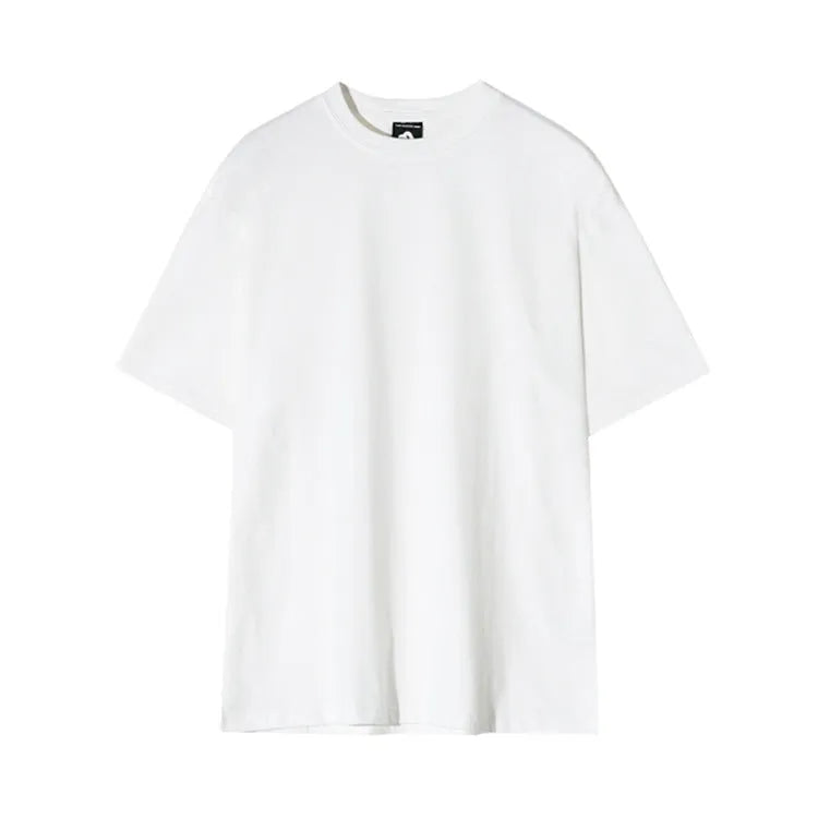 Men's slim fit cotton t-shirt in white or black with round neck and half sleeves on a model