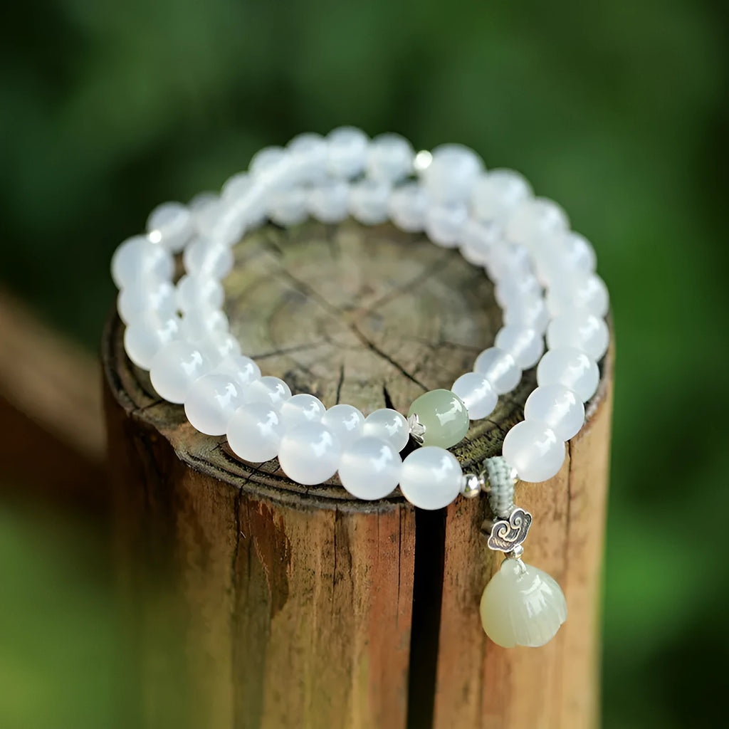 S925 silver bracelet with white agate and Hetian jade stones forming a geometric lotus design.