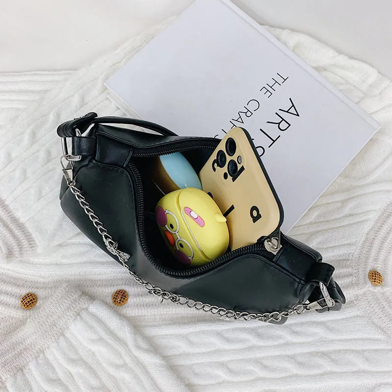 Women's black PU leather crossbody bag with butterfly chain strap and mobile phone pocket