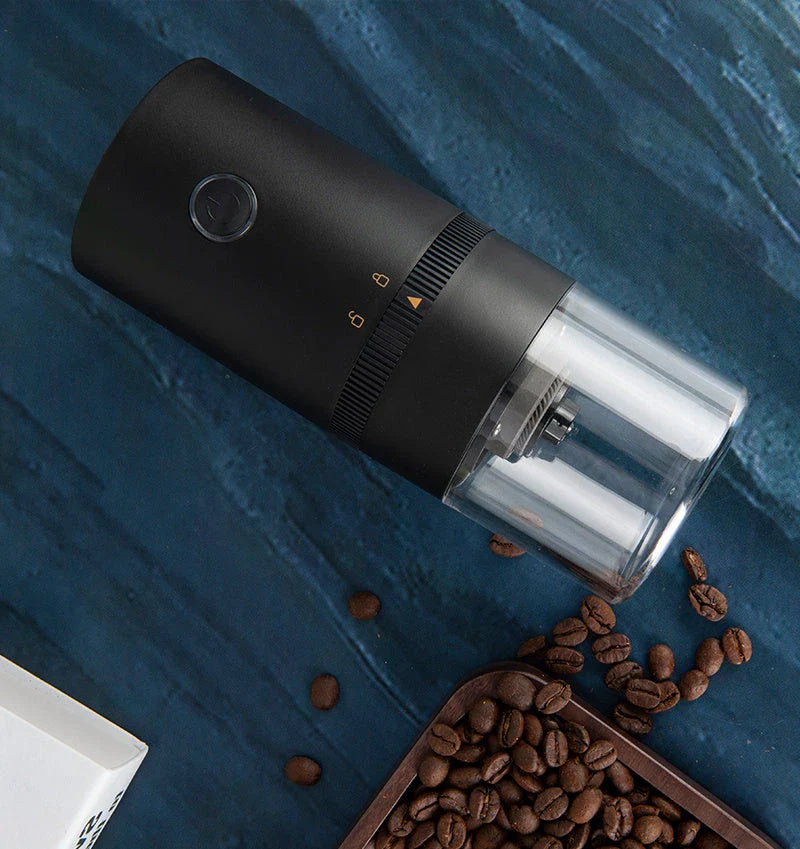 Portable electric coffee grinder with USB-C charging, adjustable grind settings, and dishwasher-safe removable bins