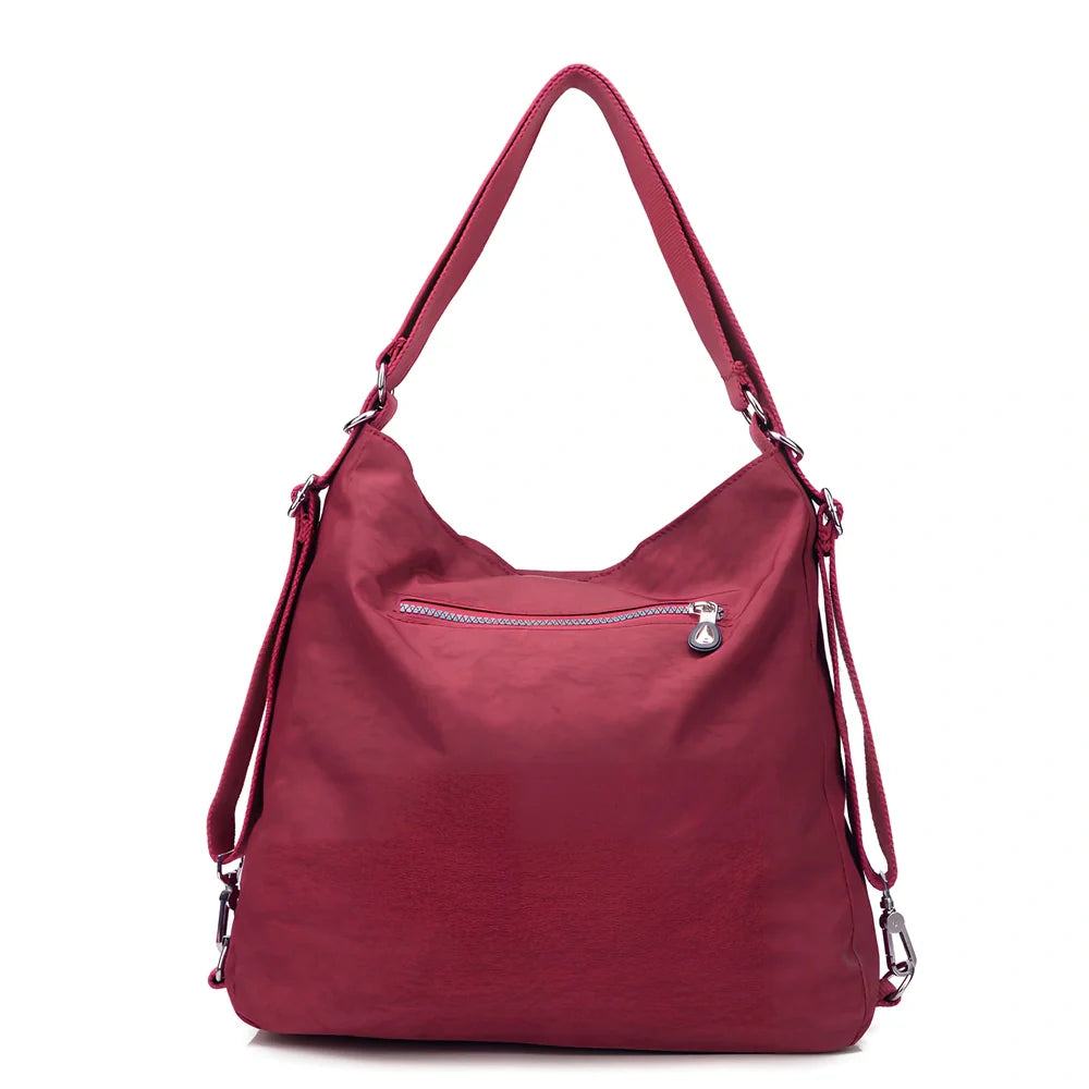 Women's waterproof nylon crossbody bag with organizational pockets and 34cm laptop capacity