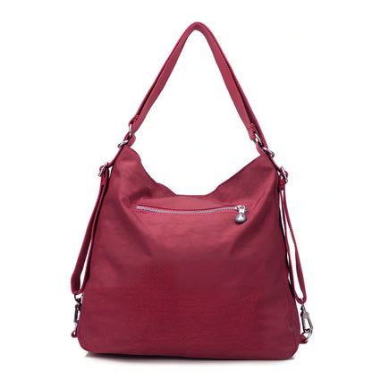 Women's waterproof nylon crossbody bag with organizational pockets and 34cm laptop capacity