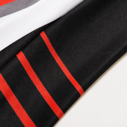 Winter cycling suit with fleece lining shown in green and red colour options with size measurements displayed